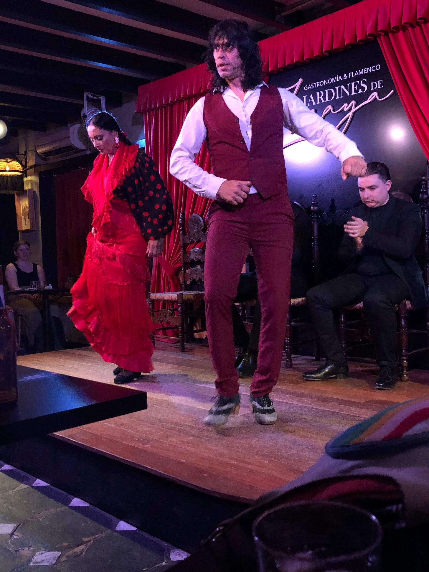 A picture of two flamenco dancers and a singer on stage in Granada
