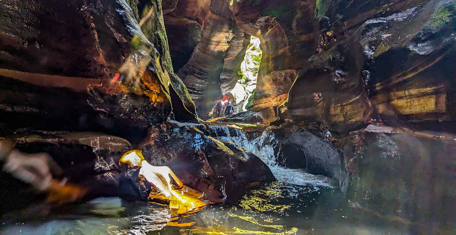 Rocky Canyon looking dark and mysterious as the creek flows between the narrow sandstone walls. 