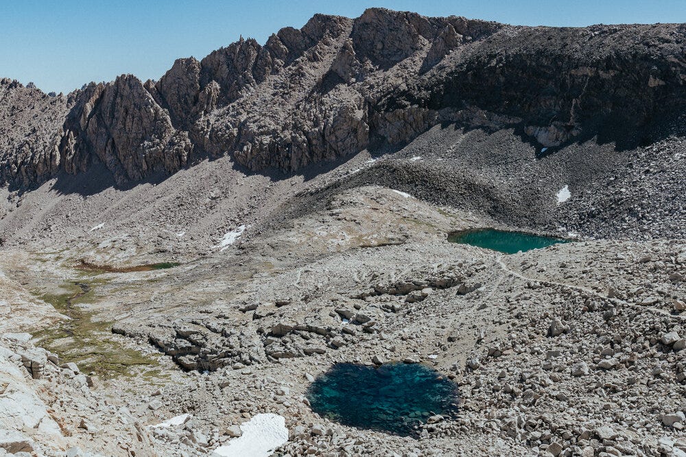 Ascending Forester Pass.  Check out the difference in color between the two small lakes.  You can also see the switchbacks coming up over the hill between the lakes.