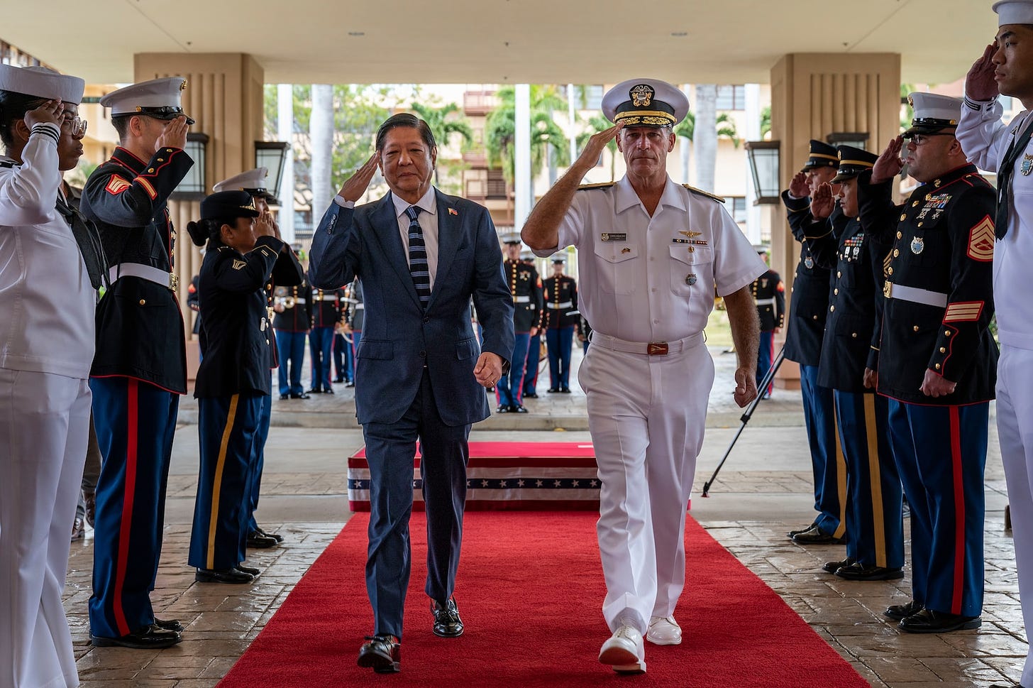 Philippine President Ferdinand R. Marcos Jr., left, walks alongside Adm. John C. Aquilino, commander, U.S. Indo-Pacific Command, during an honors ceremony at USINDOPACOM headquarters, Camp H.M. Smith, in Honolulu, Nov. 19, 2023. The visit included exchanges on regional security and mutual partnership, further developing the strong democratic, economic and strategic partnership with the Philippines codified in the 1951 U.S.-Philippines Mutual Defense Treaty. USINDOPACOM is committed to enhancing stability in the Indo-Pacific region by promoting security cooperation, encouraging peaceful development, responding to contingencies, deterring aggression and, when necessary, fighting to win. (U.S. Navy photo by Mass Communication Specialist 1st Class John Bellino)