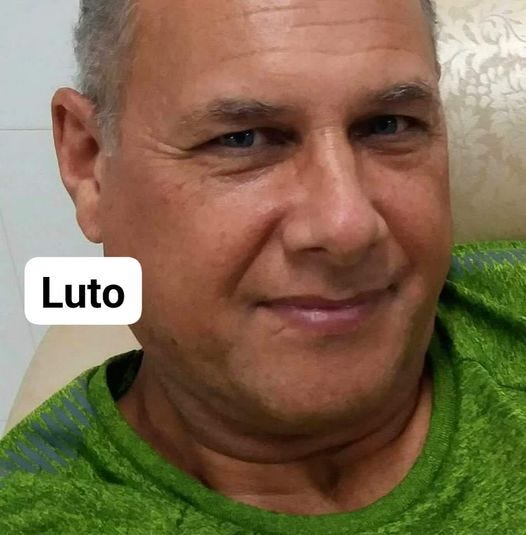 May be an image of 1 person, beard, smiling and text that says 'Luto'