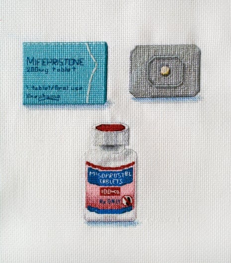 embroidered images of an abortion pill bottle