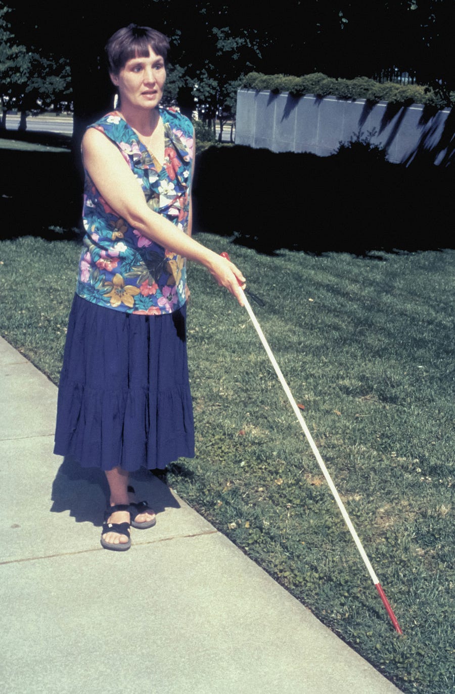 Blind woman with walking stick