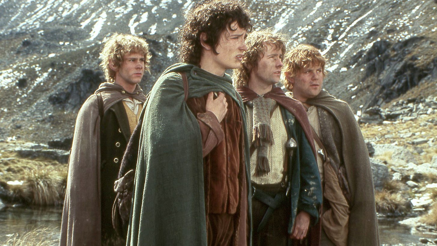 the four hobbits: merry, frodo, pippin, and sam
