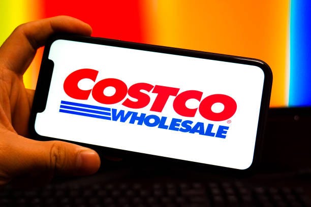 In this photo illustration, a Costco logo is displayed on the screen of a smartphone.