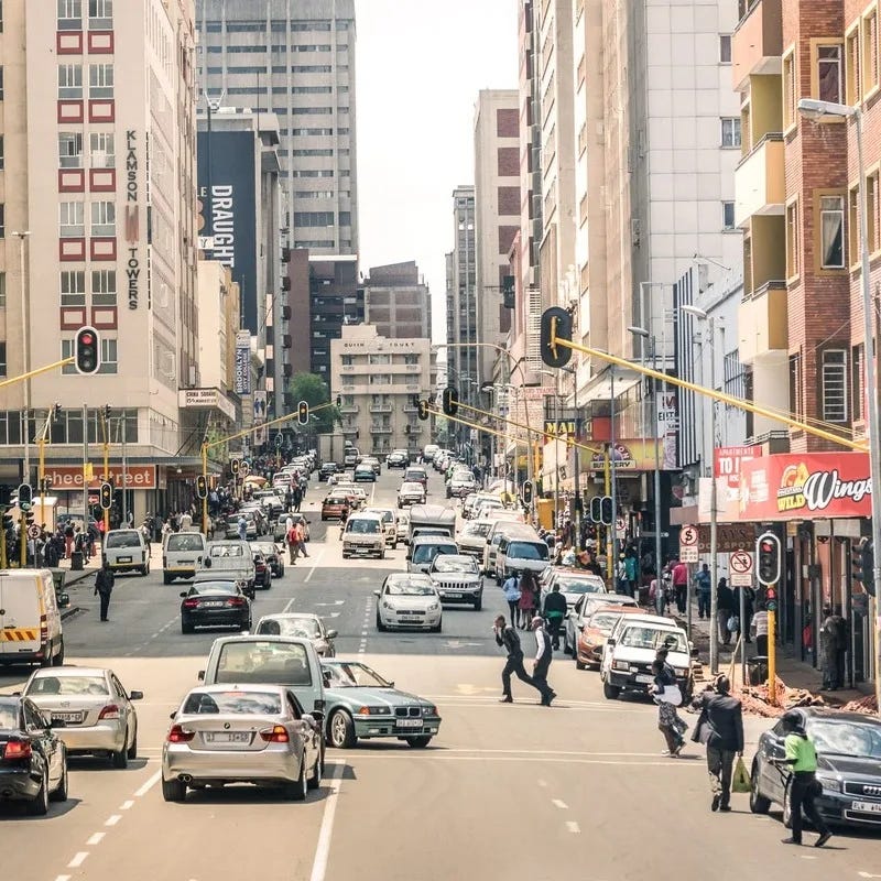 Busy Thoroughfare In Johannesburg, One Of The Capitals Of South Africa