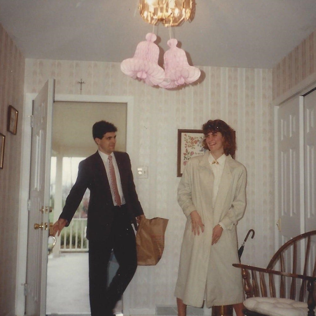 Young couple has just walked through the door for their bridal shower. She looks surprised.