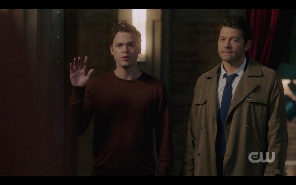 Jack with Castiel giving signature wave to Winchester brothers