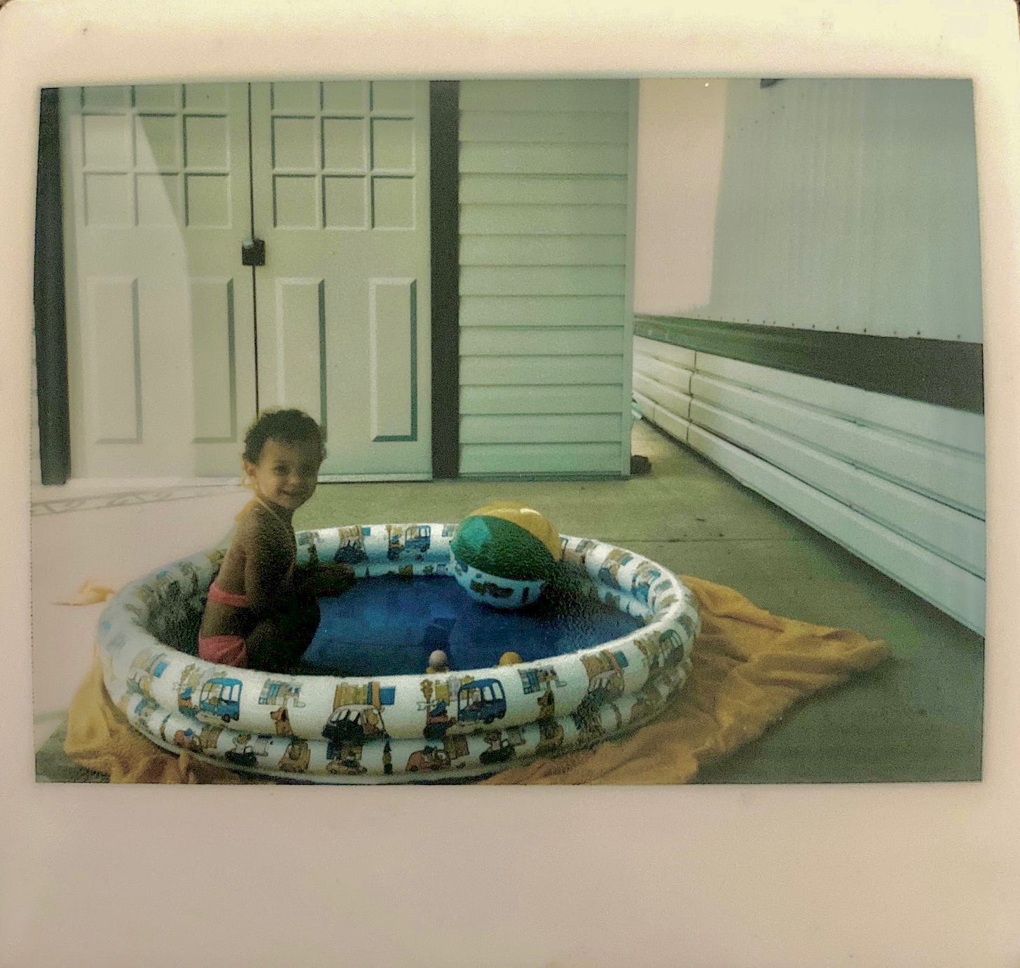 1980s little girl in backyard swimming pool