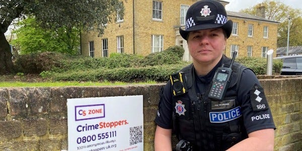 Inspector Leanne Archer with one of the new Crimestoppers signs.