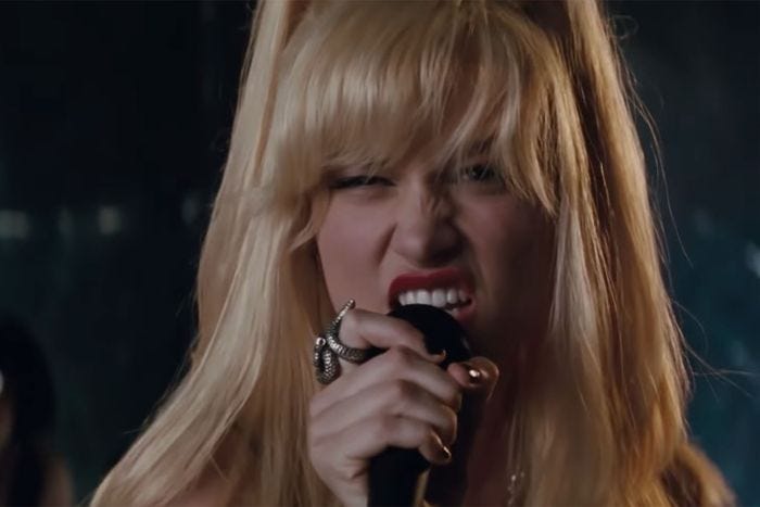 Brie Larson, in Scott Pilgrim Versus The World, singing "Black Sheep." She's sneering at the camera over the microphone.