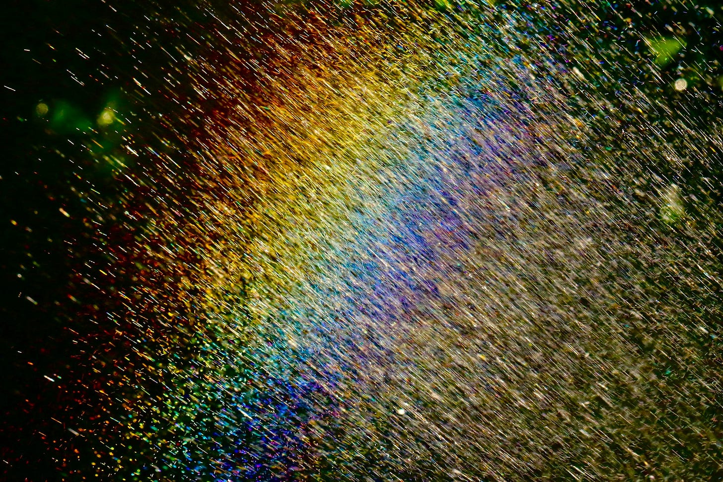 Rainbow created with garden hosepipe Rainbow created with garden hosepipe