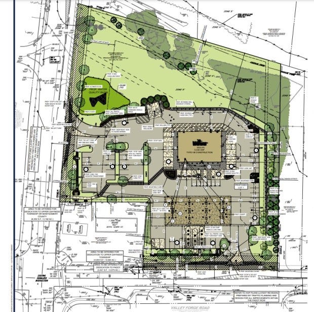 Site plan showing a planned new Wawa convenience store with fuel pumps, with Sumneytown Pike at left and Valley Forge Road at bottom, as presented during the Nov. 21, 2023 Upper Gwynedd township commissioners meeting. (Image provided by Wawa developer)