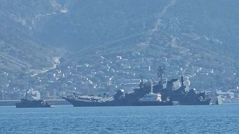 Russian navy ship appears to be heavily damaged in Ukrainian sea drone  attack | World News | Sky News