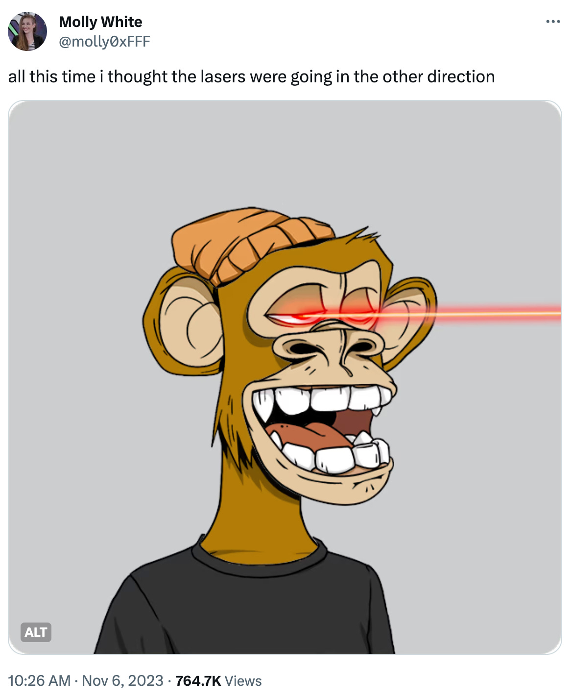 Tweet by Molly White with text "all this time i thought the lasers were going in the other direction". Image: Bored Ape #9291. A brown-furred ape, wearing a slouchy orange beanie and black t-shirt, has its mouth open in a sort of smile. There are red laser beams shooting out of (or perhaps into) its eyes.
