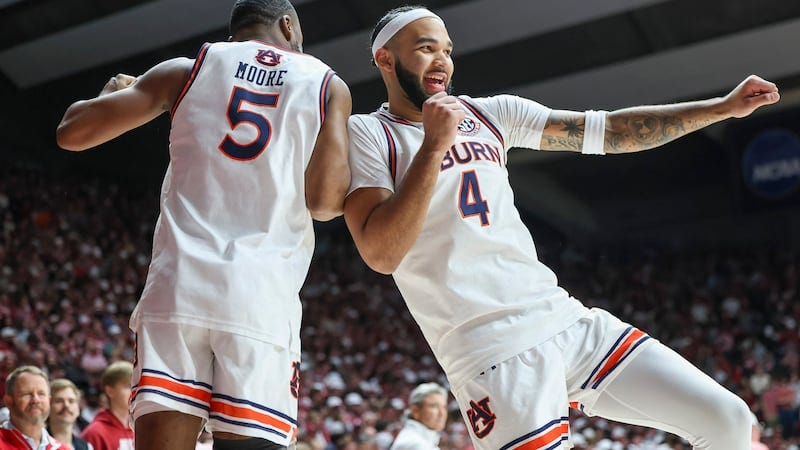 Auburn's Chris Moore (5) and Auburn's Johni Broome (4) rev up for the game before tip of the...