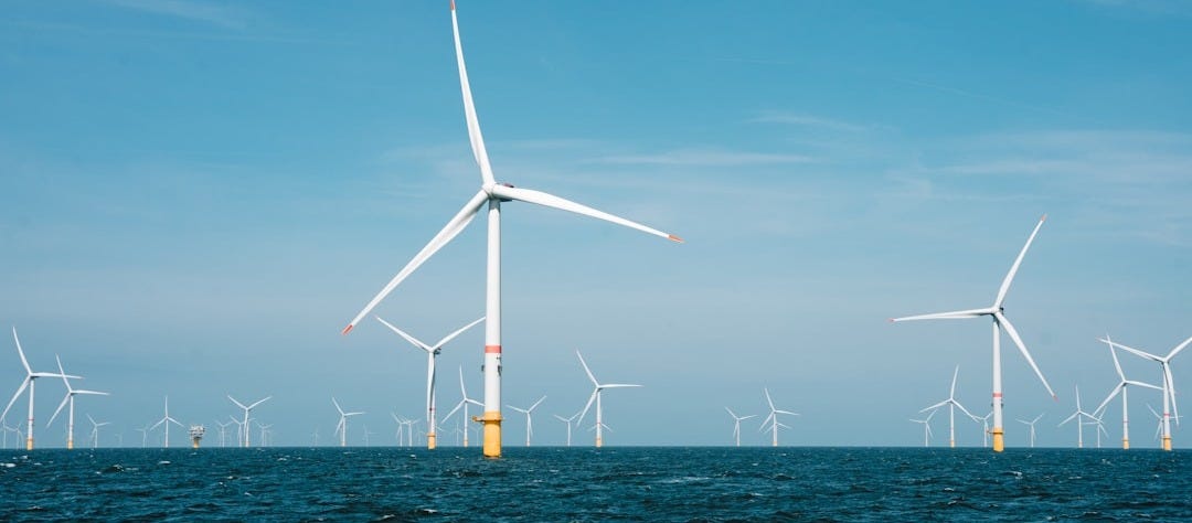 a group of wind turbines in the ocean a group of wind turbines in the ocean