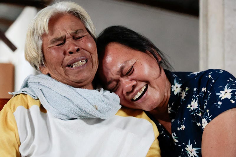 Wiwwaro Sriaoun, 53, mother of Thai hostage Watchara Sriaoun who was captured during the deadly Oct 7, 2023 attack by Hamas, reacts with her relative as her son is released from Gaza, at her house in Kut Yang village, Udon Thani province, Thailand on Thursday. (Reuters photo)