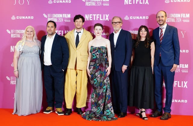 The cast of Joy and Louise Joy Brown at a film premiere