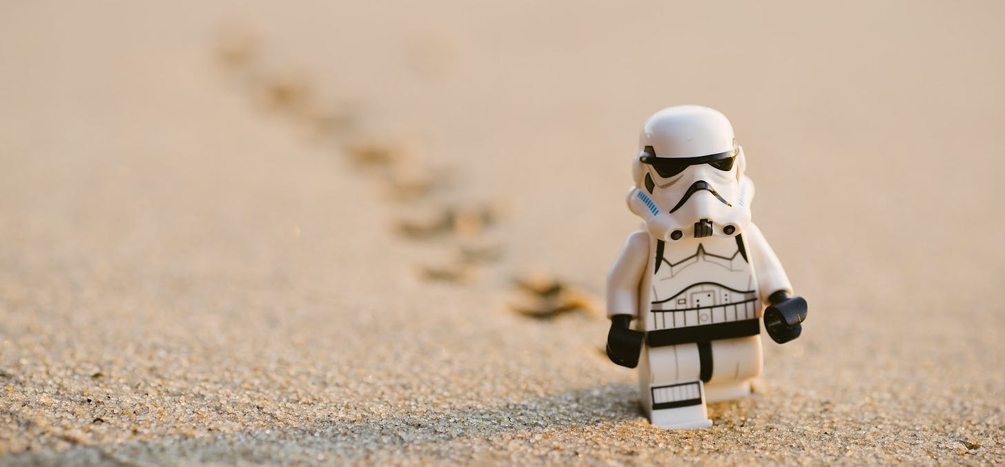 Stormtrooper LEGO minifig walking in the sand