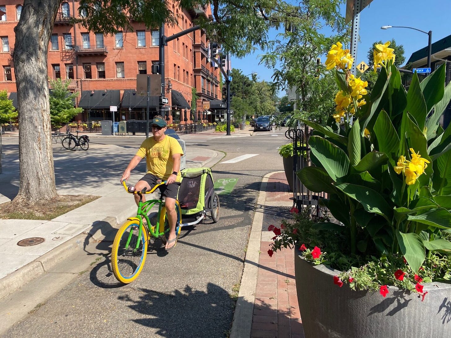 A bicyclist on a protected bike lane in Boulder