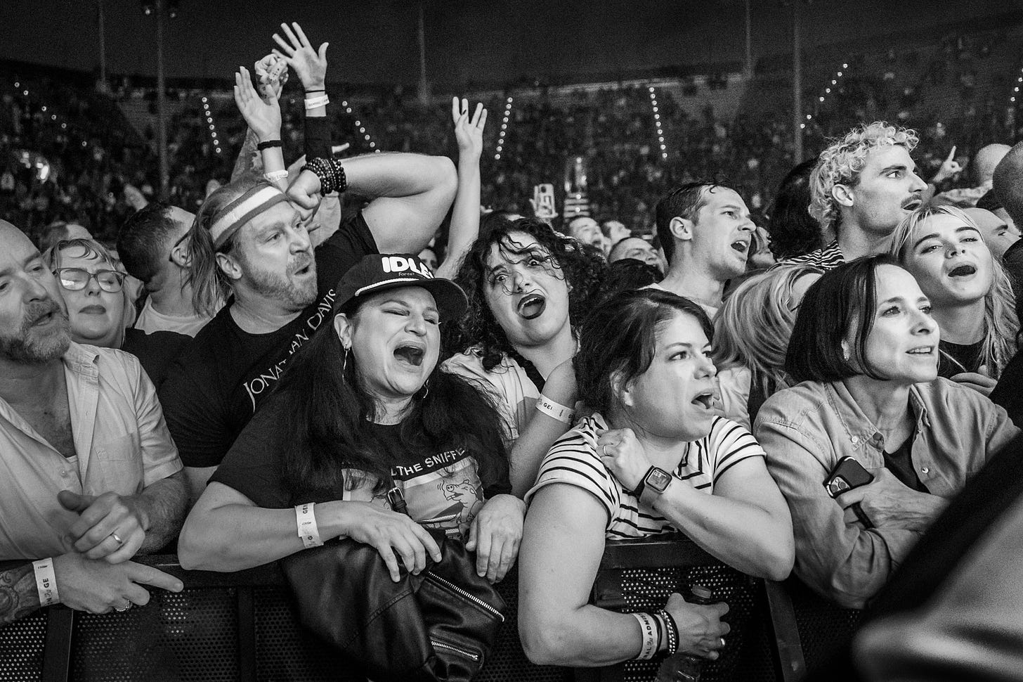 May be a black-and-white image of 6 people and crowd