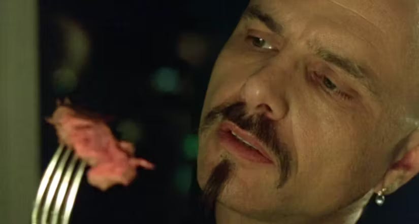Cipher from The Matrix eating steak