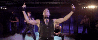GIF: Channing Tatum dances in a black silk vest and tie with no shirt on