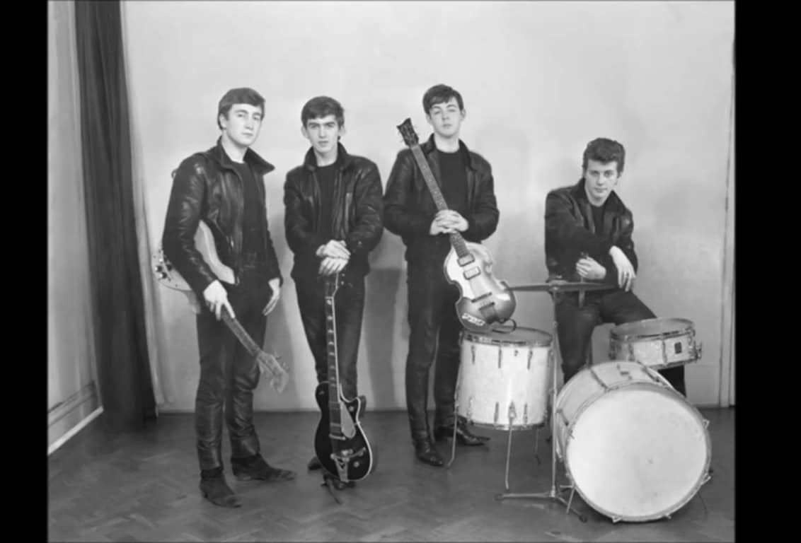 The Beatles in early 1962. John Lennon, George Harrison, Paul McCartney, Pete Best - all clad in leather tousers and jackets.