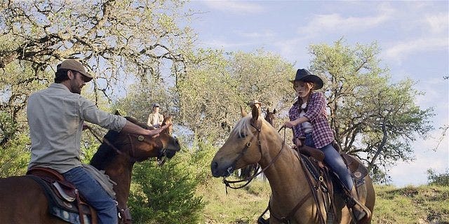 Walker Cordell keeping Stella safe on their horses.