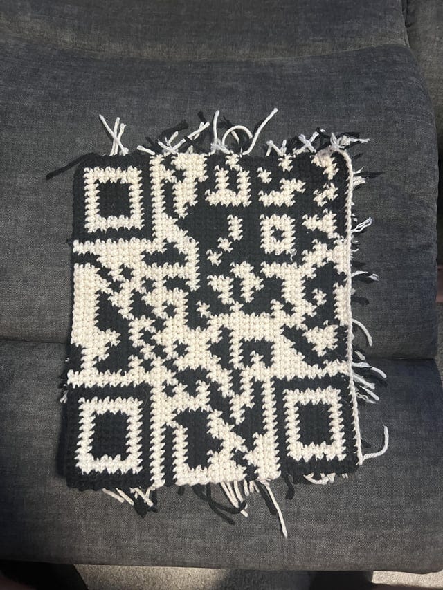 r/crochet - a piece of fabric with a qr code pattern