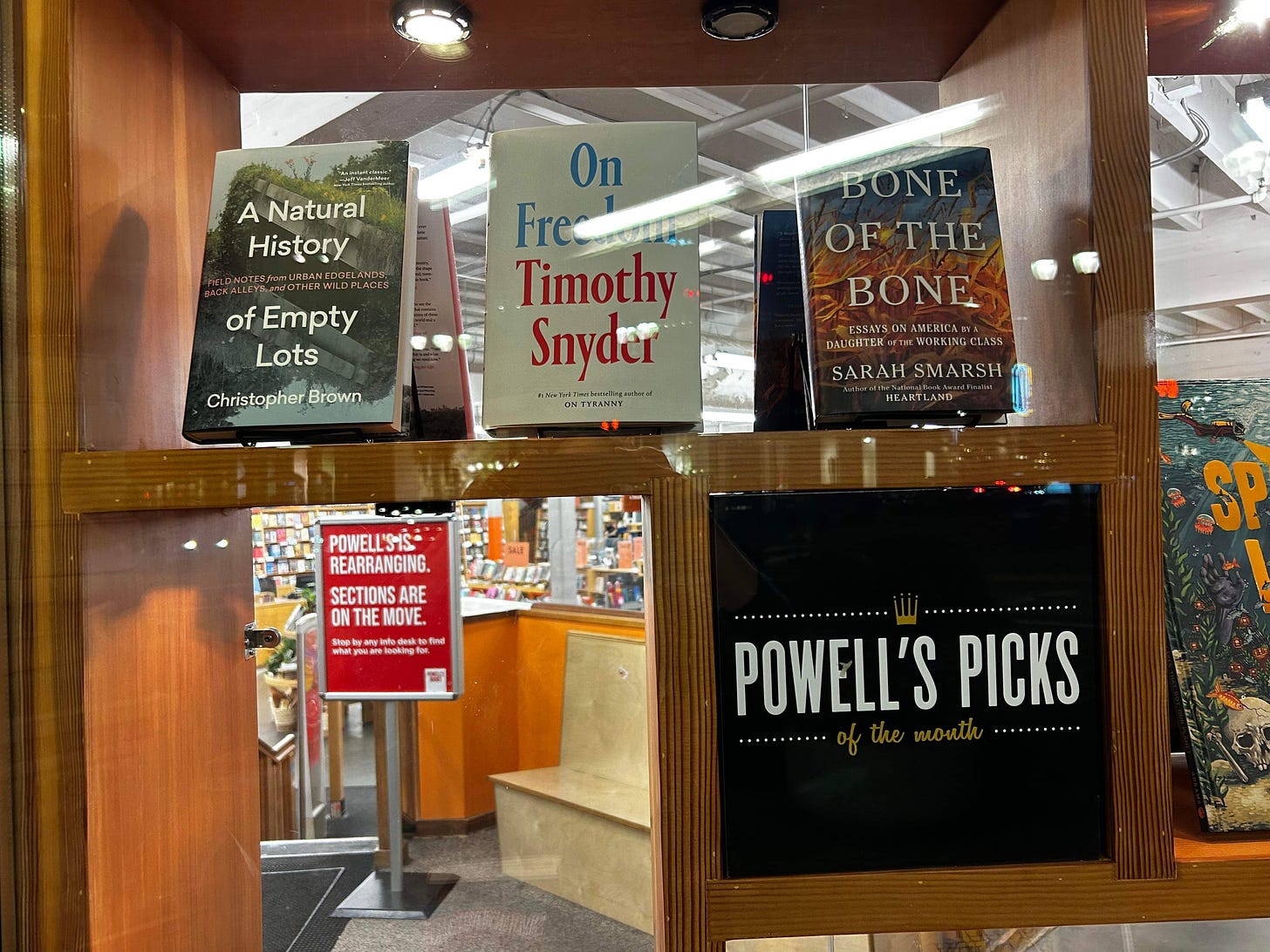 Window display of A Natural History of Empty Lots and other Powell's Picks