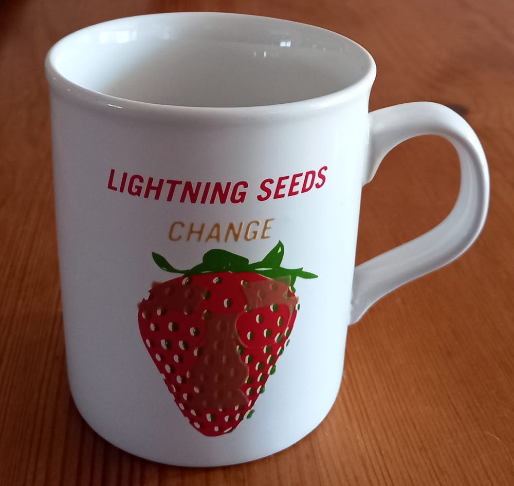 Coffee mug promoting the Lightning Seeds' LP Change.