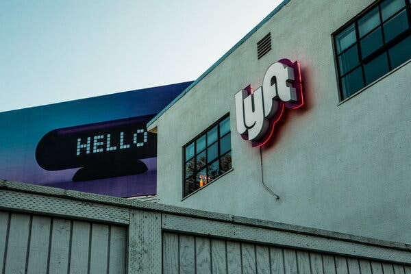 A photo of a building with a colorful Lyft sign.