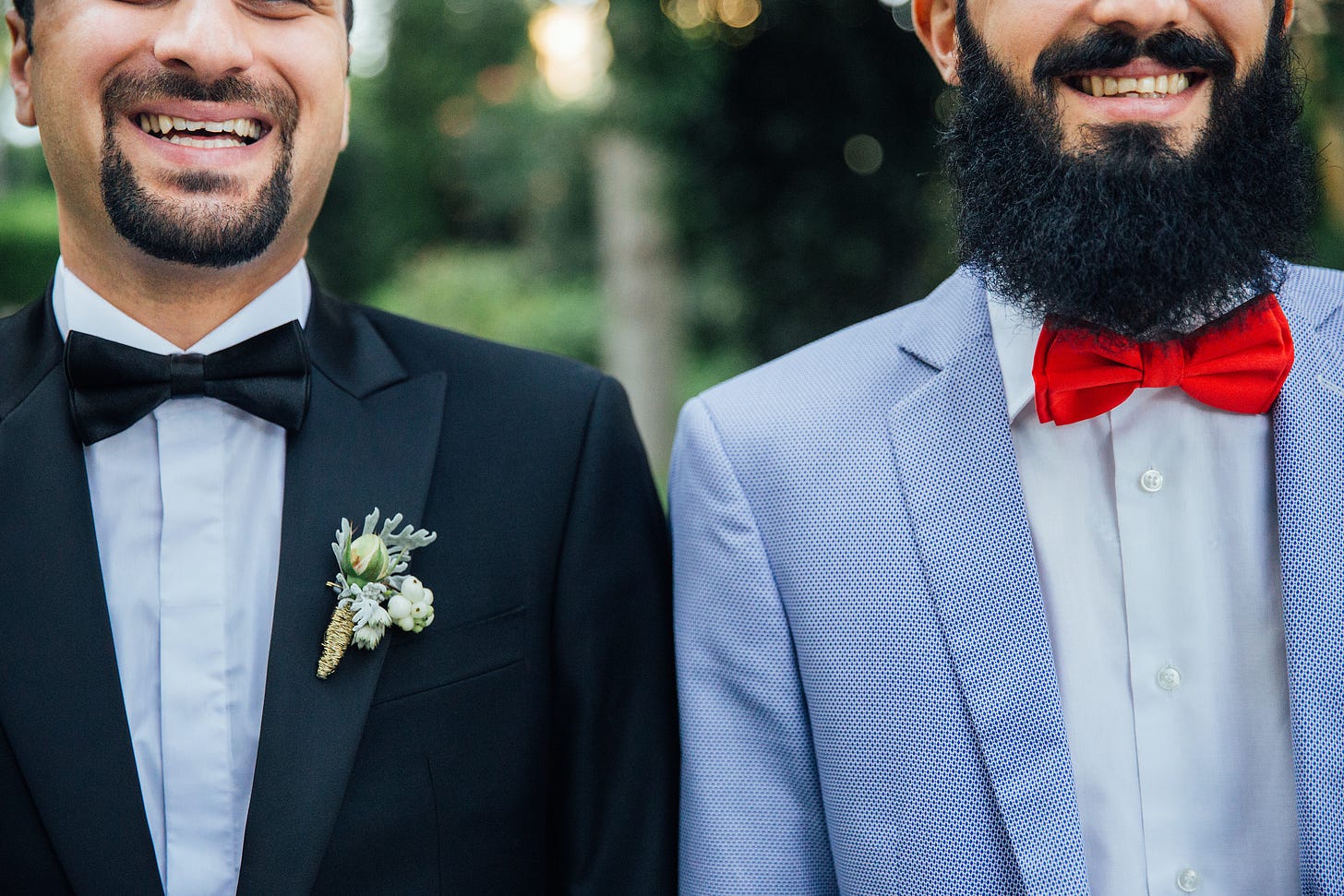 Two bearded men in tuxedos