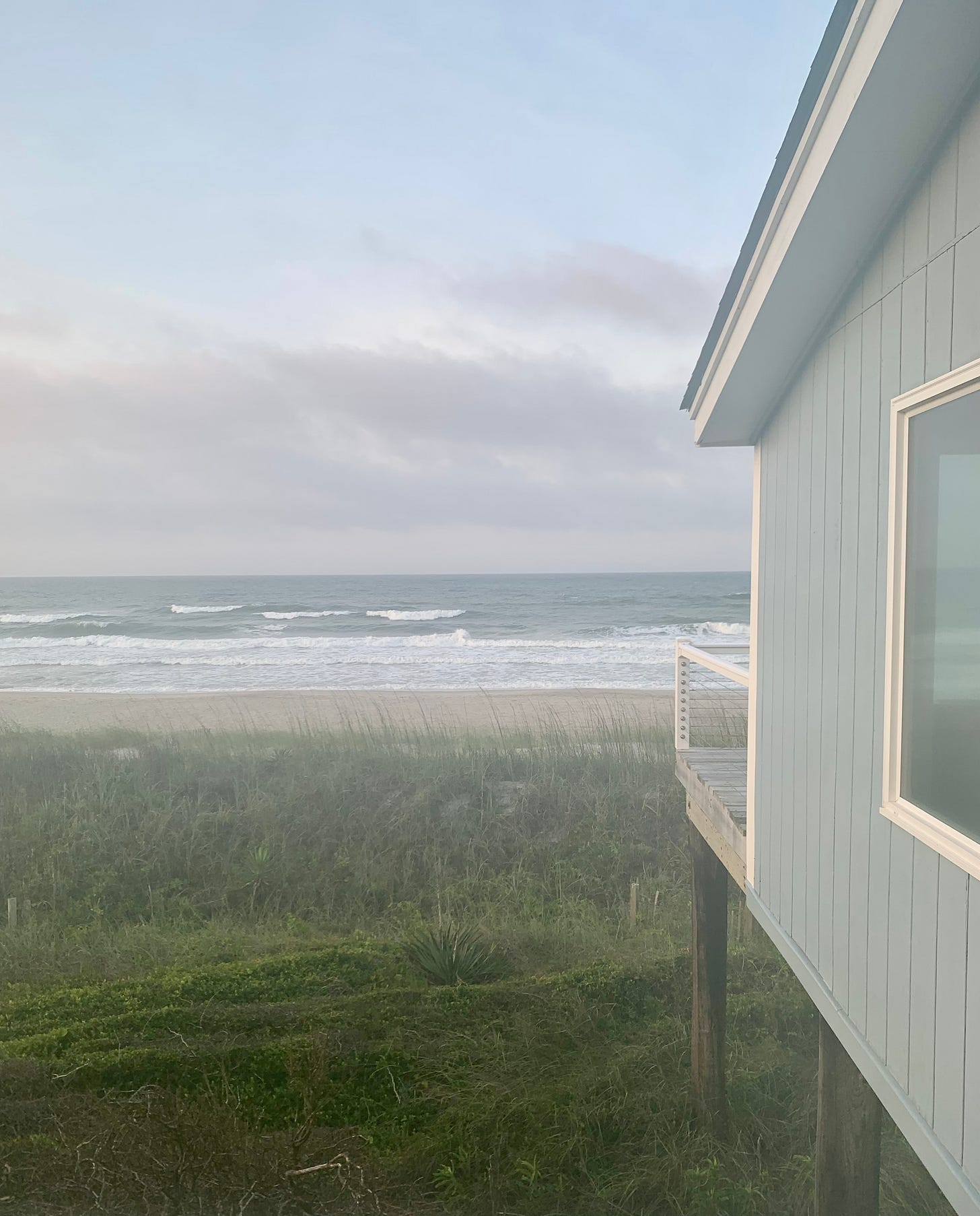 Pine Knoll Shores beach from side porch of house, looking out to light waves