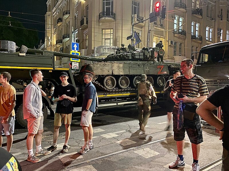 File:Young people next to the tank PMCs Wagner.jpg