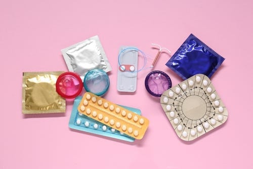 Several condoms and contraceptive pills

Description automatically generated