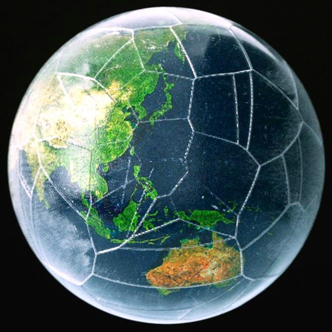 a glass ball with a map of the world in it a glass ball with a map of the world in it