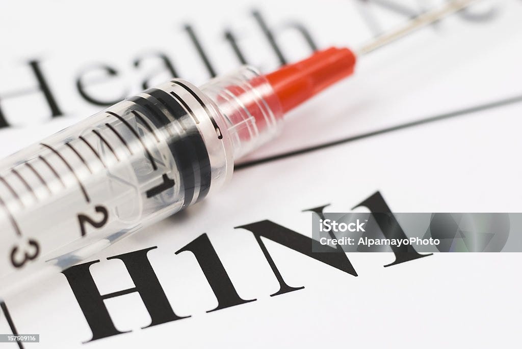 H1N1 Flu Shot, Vaccination close-up (red syringe) - I  Influenza A Virus Stock Photo