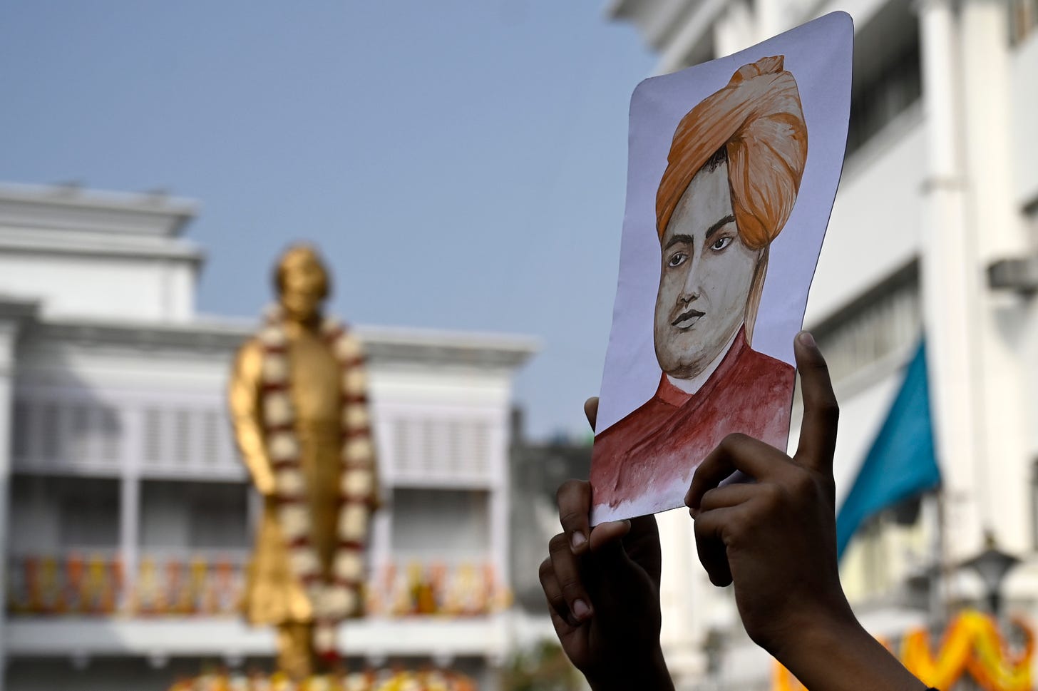 A student holds up a picture of Swami Vivekananda on January 12, 2024. (Photo by Samir Jana/Hindustan Times via Getty Images.)
