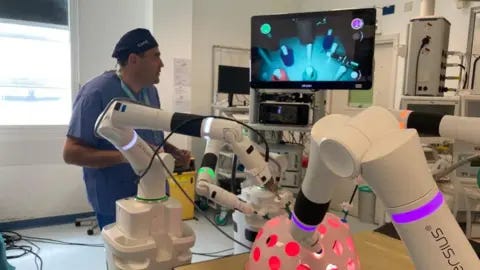 A surgeon using the robot