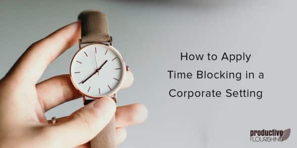 Person holding a brown leather watch. Text overlay: How to Apply Time Blocking in a Corporate Setting
