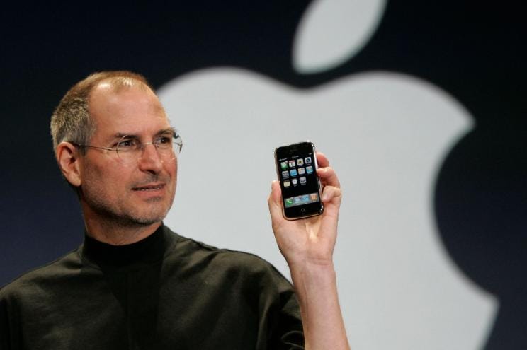 Then-Apple CEO Steve Jobs holds the iPhone in San Francisco, California, on Jan. 9, 2007.
