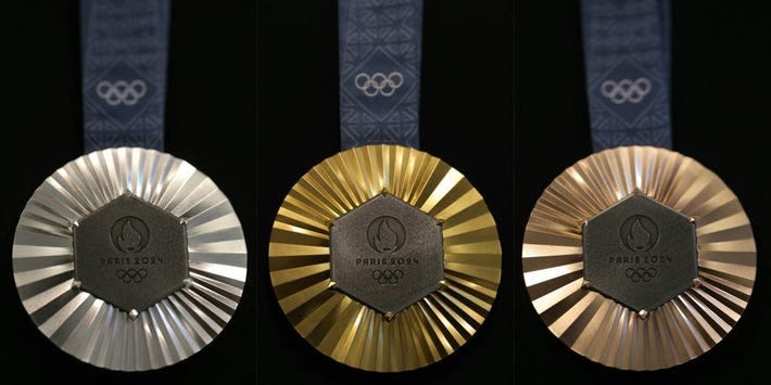 From left: the silver, gold and bronze medals of the Paris 2024 Olympics