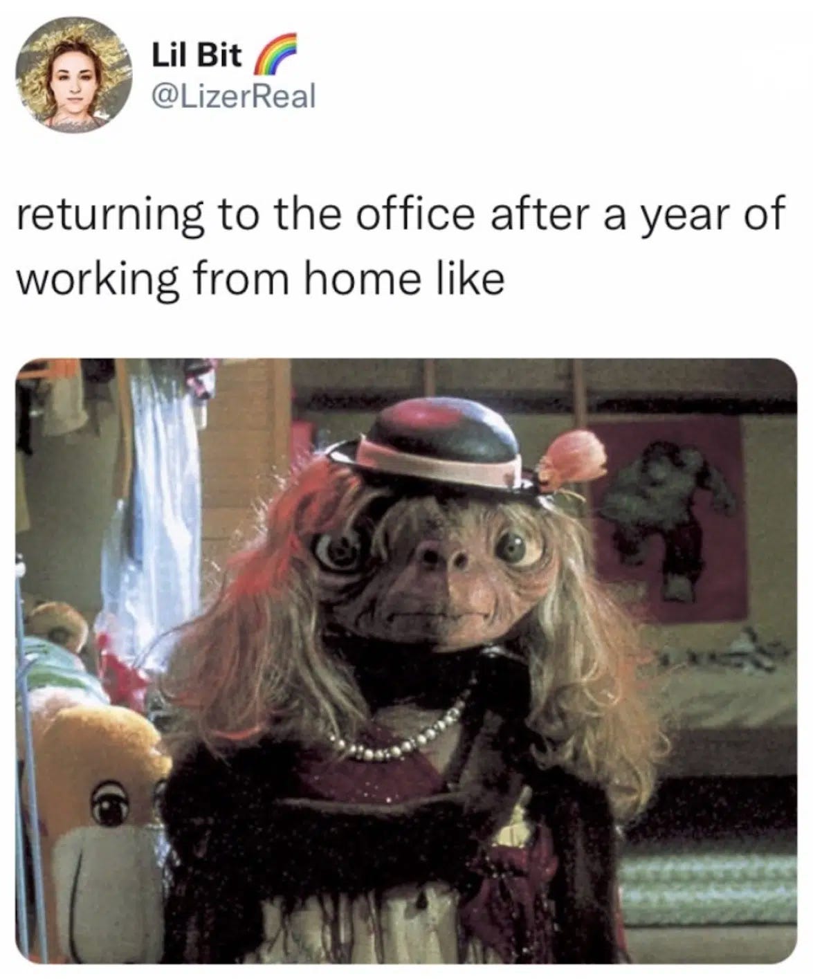 Caption: returning to the office after a year of working home like  Picture of E.T. dressed in a wig, hat, dress, etc. 