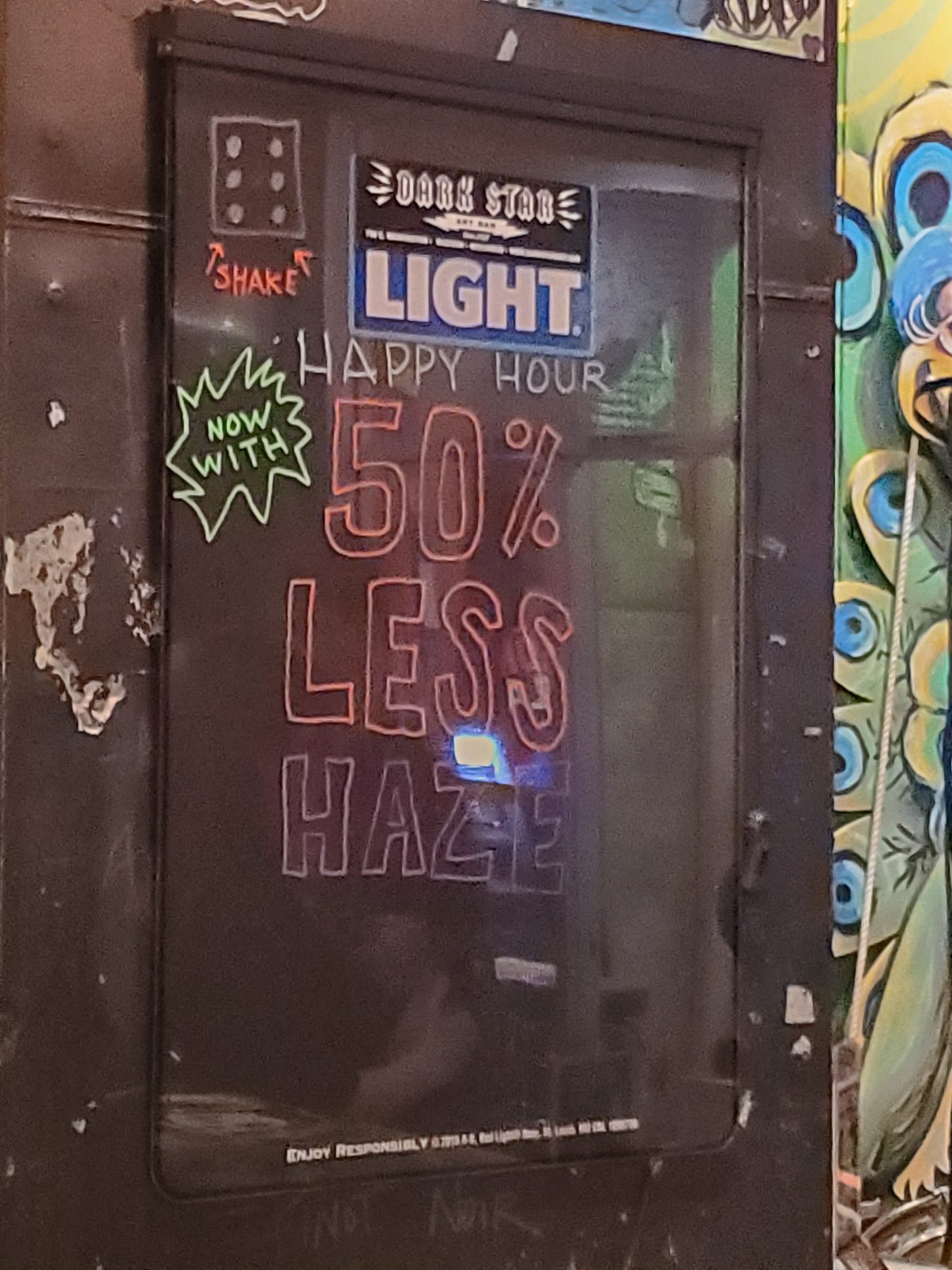 A hand-written bar sign reads "Happy Hour: Now with 50% Less Haze!"