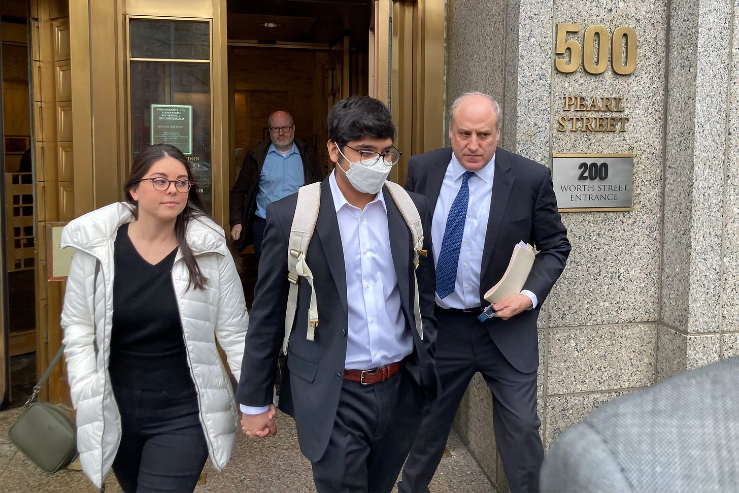 Former FTX engineering chief Nishad Singh, front center, departs from federal court in New York on Feb. 28.