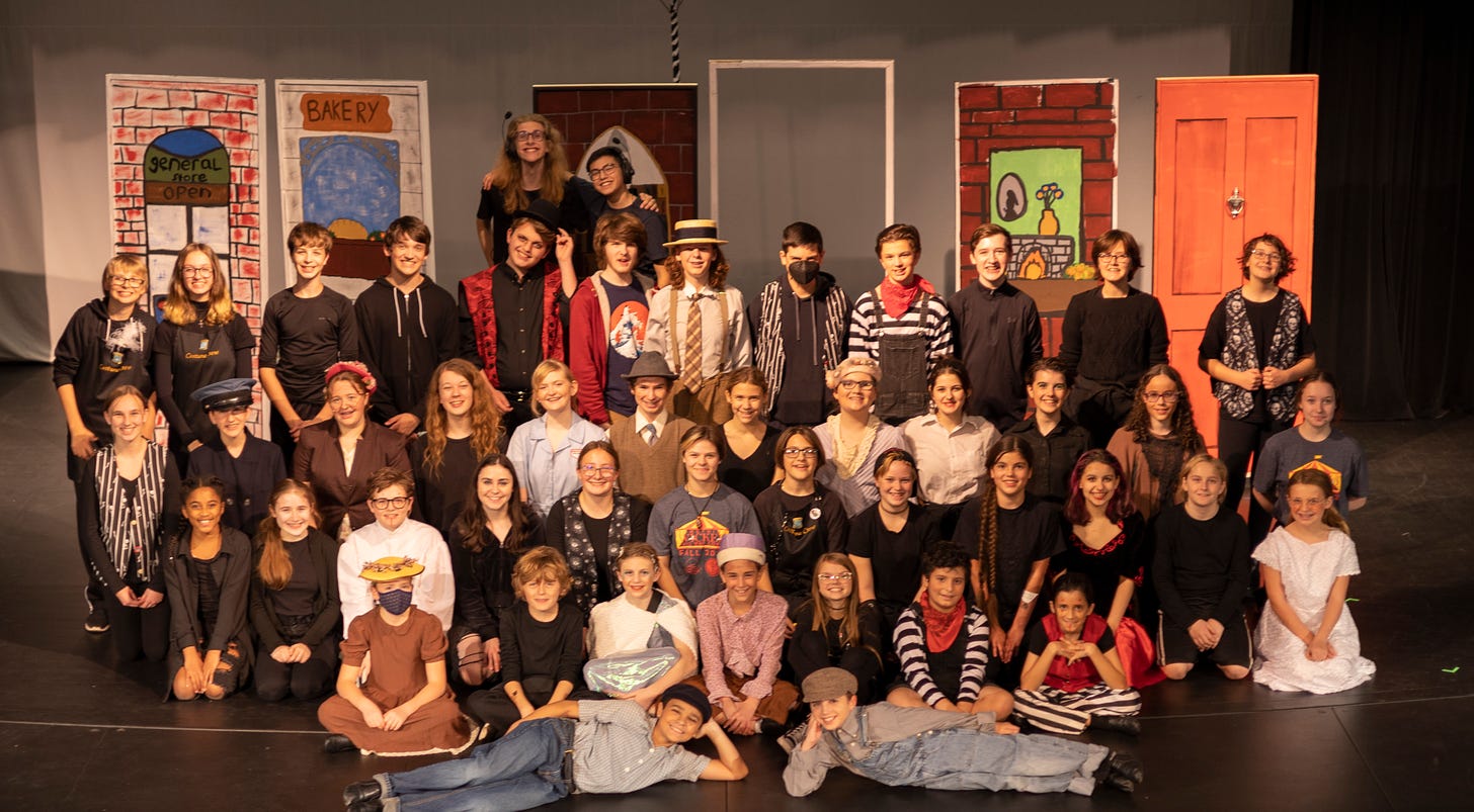 A motley assemblage of teens in mostly 1950s attire gathered together on the Hannah stage