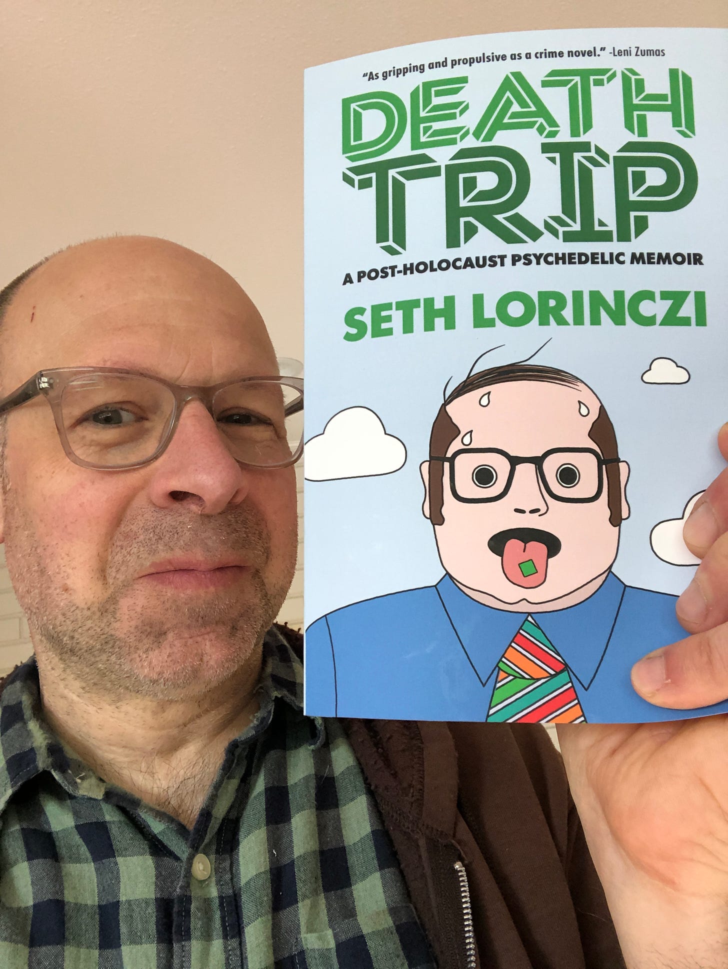 Author Seth Lorinczi with a copy of his book "Death Trip."
